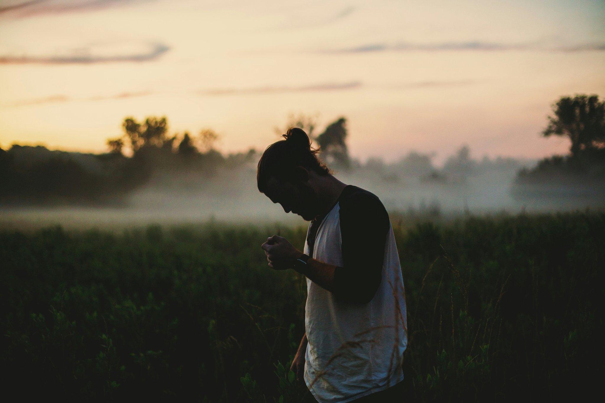 A person overwhelmed by distractions while trying to meditate.