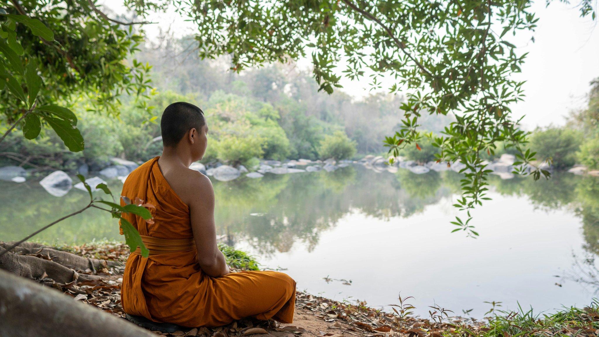 Person washing dishes with focused expression